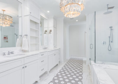 Bright bathroom photo with gorgeous tile and chandelier.