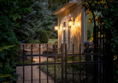 Twilight summer gateway into backyard real estate photo.