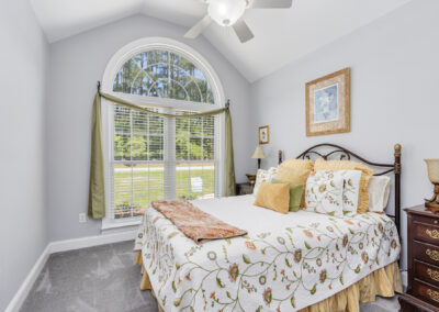 Real estate photo of bright bedroom in Greenwood, SC