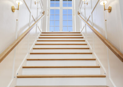 An elegant staircase in Greenville, SC invites you upstairs.