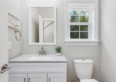 Clean modern half-bathroom real estate listing photo in Greenville, SC